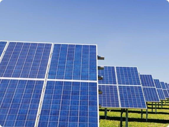 Close view of solar panels in a rural setting.